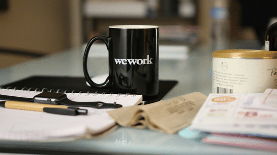Coffee mug, stationery, and essentials arranged neatly.