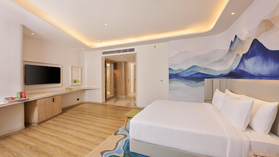 Contemporary guest room at Riviera Sarovar Portico, Pathankot offering a clean design, wooden flooring and a relaxing atmosphere.