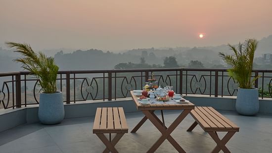 Sunrise breakfast at Sky Deck with panoramic views and seating arrangements at The Dukes Retreat