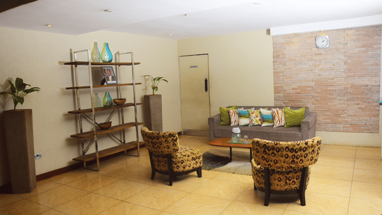 Relaxed reception area with wicker furniture at The Zehneria, Nairobi