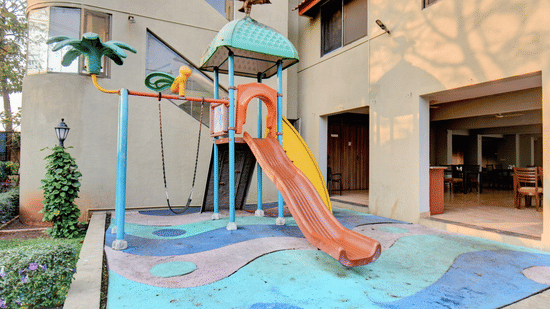 Kids’ play area with colorful slide and water feature at VITS Lonavala.