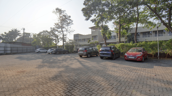 Spacious parking area with guest vehicles at VITS Lonavala.