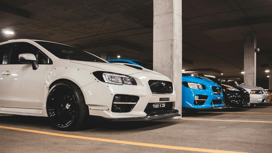 Cars parked in a covered multi-level parking garage