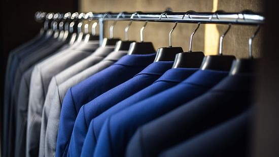An image of coats hanged in a row