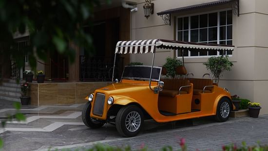 Image of a vintage car parked in front of a building at 
