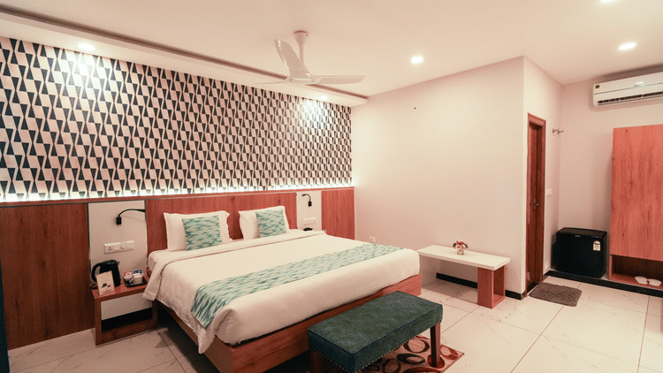 A spacious and inviting bedroom with a large bed and elegant decor -  MGM Whispering Wind's Resorts