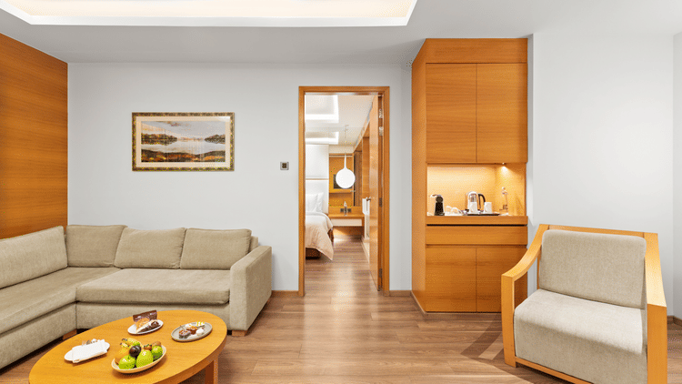 Club Suite room with a cozy sofa and a round table at The Residency Towers Coimbatore