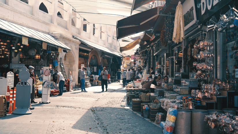 An overview of a street market with many shops open with items to be sold in Broadway Ernakulam.