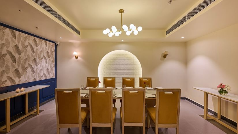 table for eight in the private dining room of Flavours all day dining at ABN Sarovar Portico, Jim Corbett