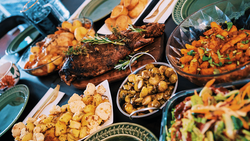 A close-up of various plates filled with food.
