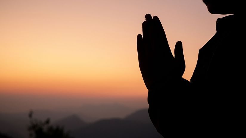 silhouette-girl-praying-beautiful-sky-background