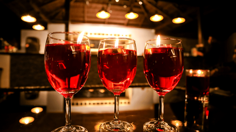 3 glasses of drinks placed on a bar counter at Amara Grand Baga, Goa.