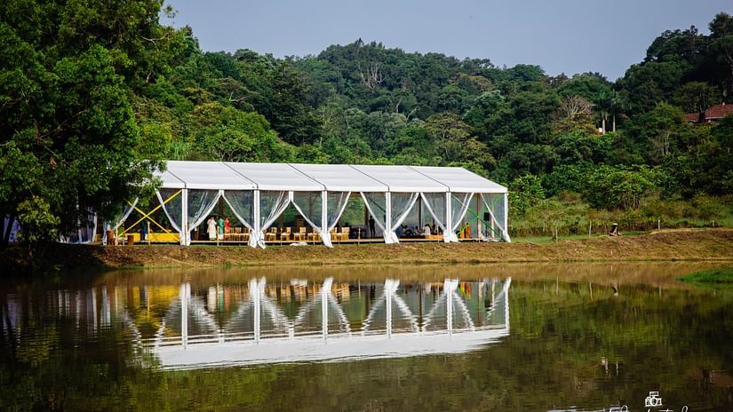 Wedding Decor with a white conopy next to the lake at The Lakeside, Capitol Village Resort, Madikeri