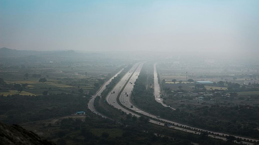 Aerial view of a highway passing through on a foggy day