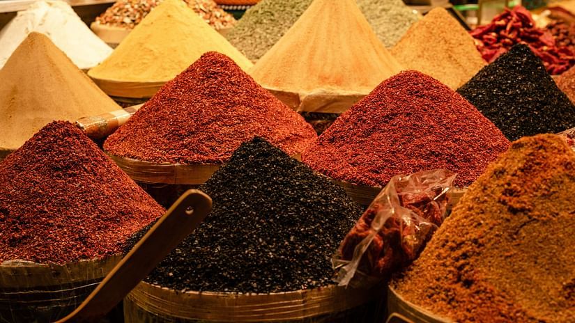 Spices stacked in piles.