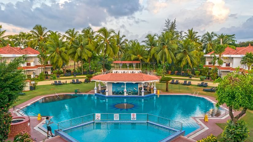 aerial view of the swimming pool at heritage village resort and spa in goa