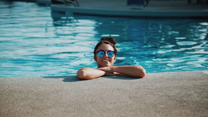 woman in pool at our resort