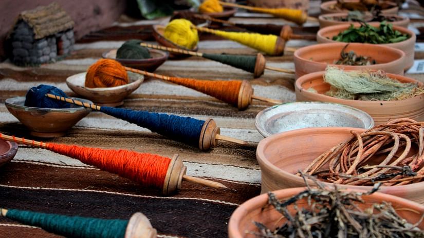 textile threads in many colours kept on a table