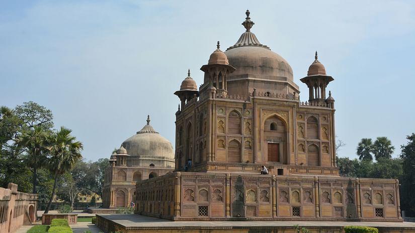 An overview of Khusro Bagh with manicured grass surrounding it