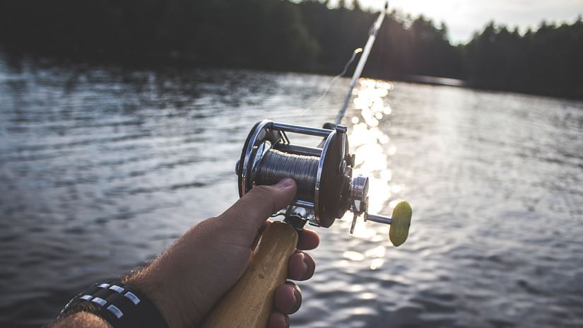 a person holding a fishing rod