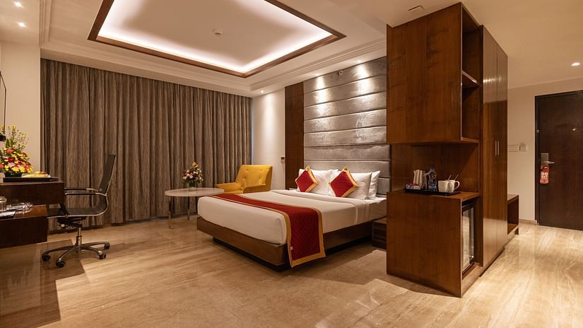 Spacious executive room with a king-size cozy bed and interior lighting at Icon Premier Hotel by Bhagini, Devarabisanahalli
