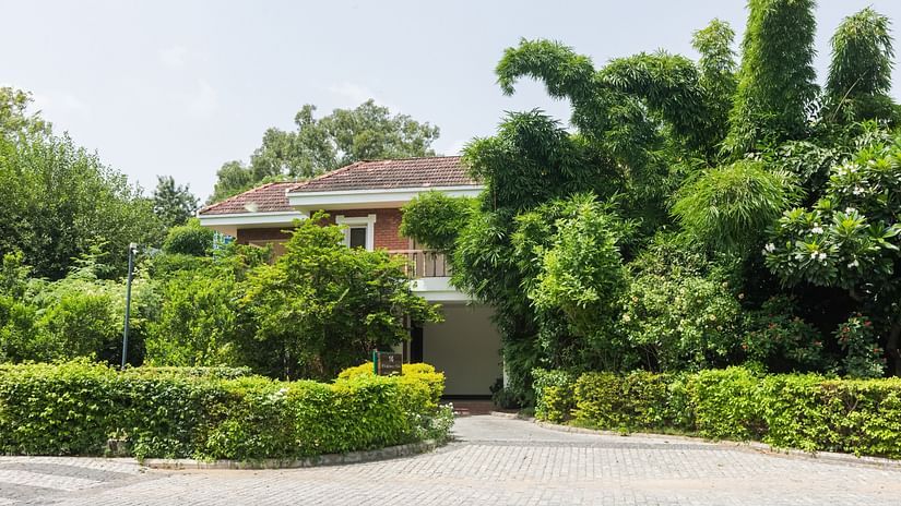 Facade of Wildflower Villa with greenery around - Karma Lakelands.