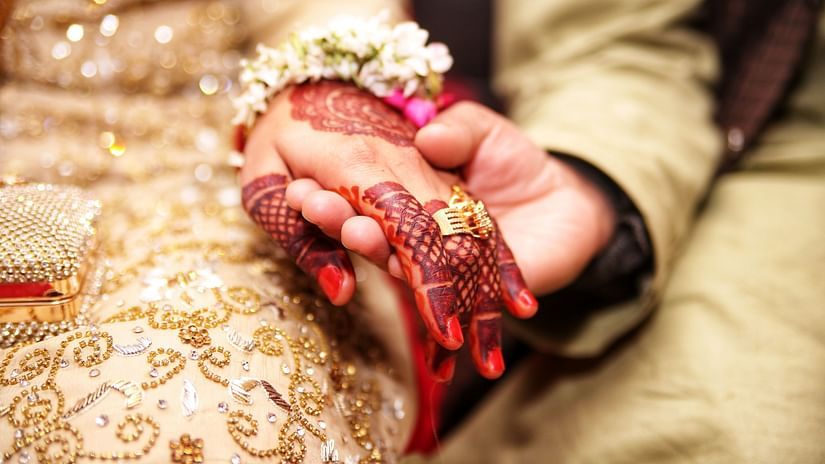 bride and groom holding hands
