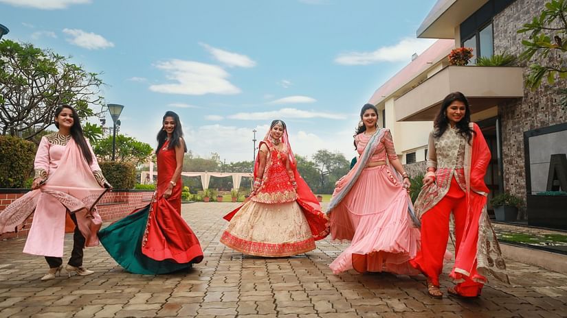 bride and bridesmaids dancing