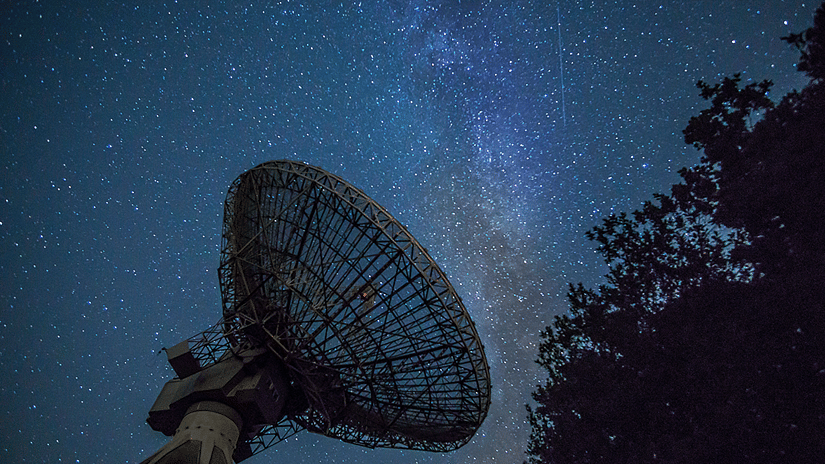 Constellations seen with the shadow of a tree and a satellite antenna