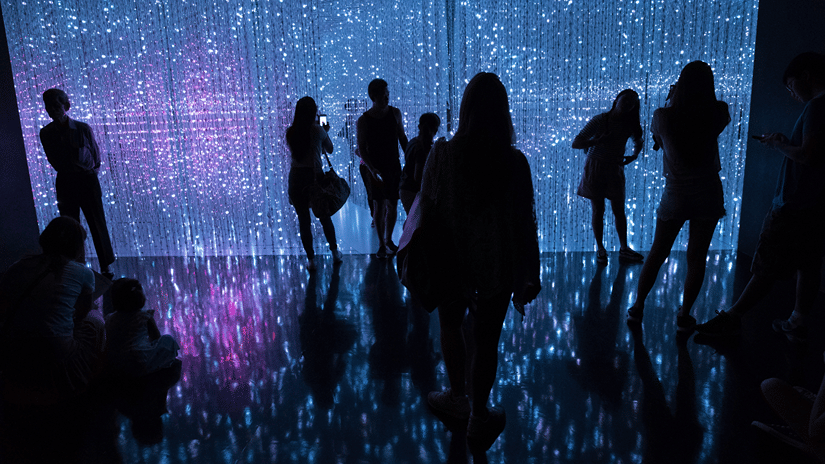 People gathering in front of an illuminated screen, often exhibited at Birla Industrial & Technological Museum