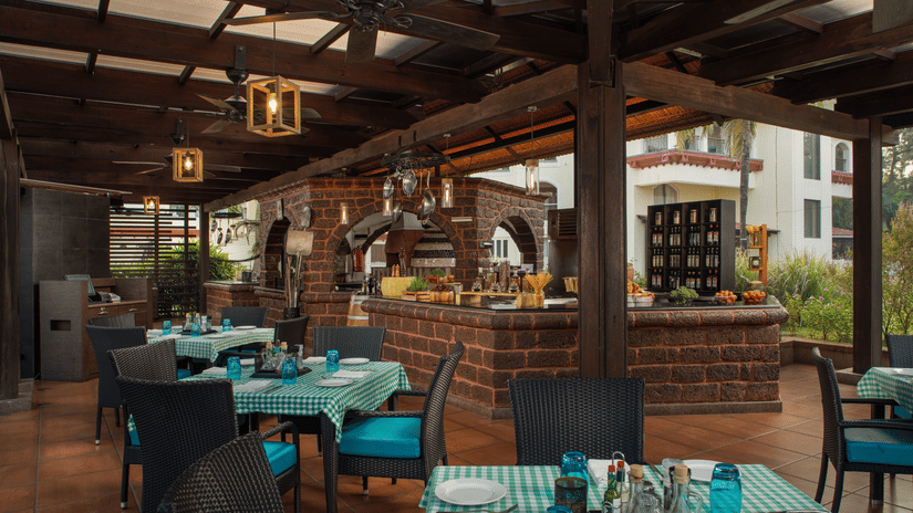 Salute, an Italian restaurant with its outdoor seating facility in view at Kenilworth REsort & Spa, Goa.