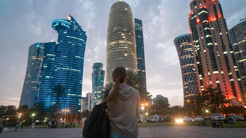 Back View of a Woman Looking at the City Skyscrapers