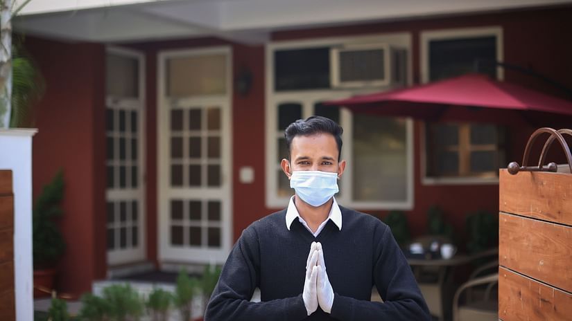 A butler greeting the viewer - Lamrin Boutique Cottages Rishikesh