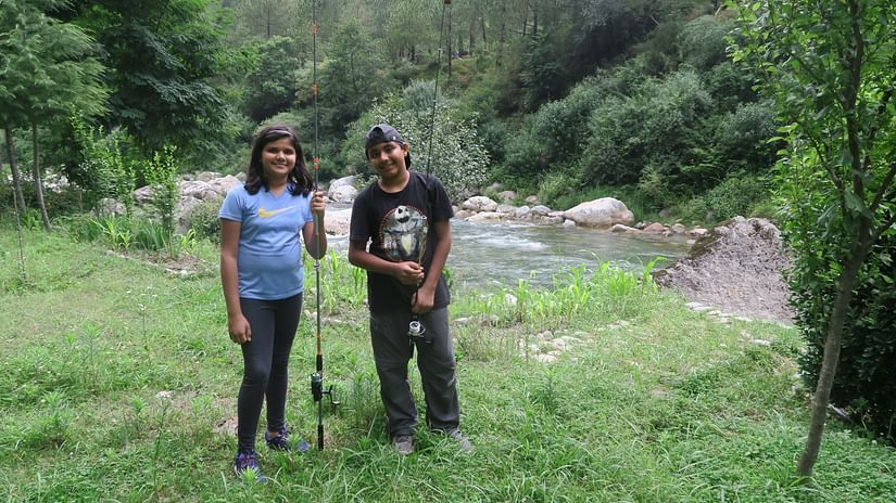 Let s Camp Tirthan activity trout fishing
