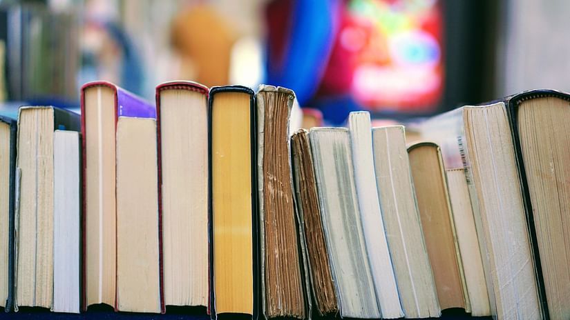 a closeup shot of books kept on a rack