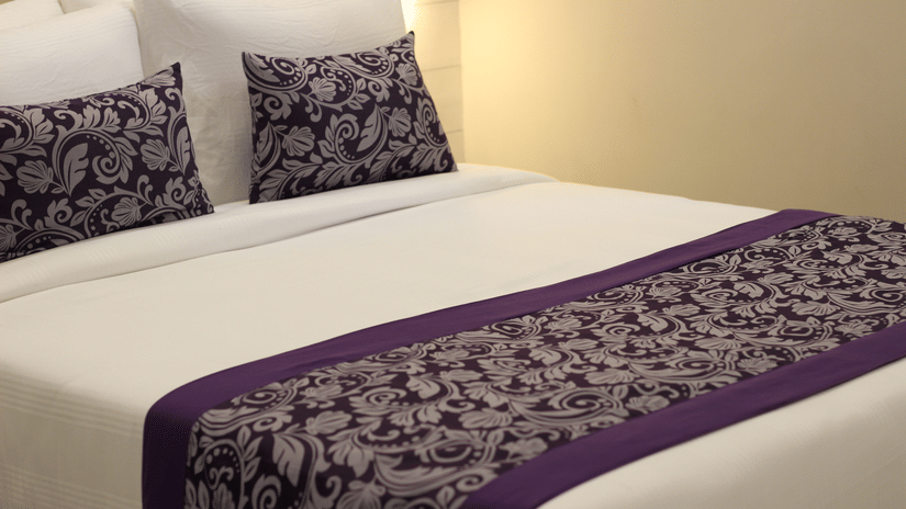 A closeup shot of a queen room in Deluxe Room - Pride Biznotel Canopus, Digha