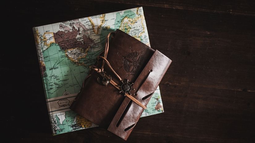 Leather book kept on a map
