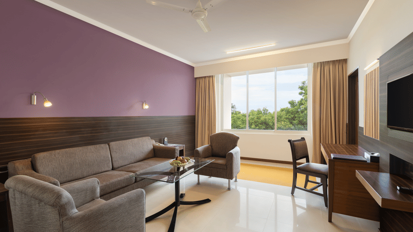 An overview of the living room in the Suite at Sangam Hotel, Thanjavur - Thanjavur Hotel Location