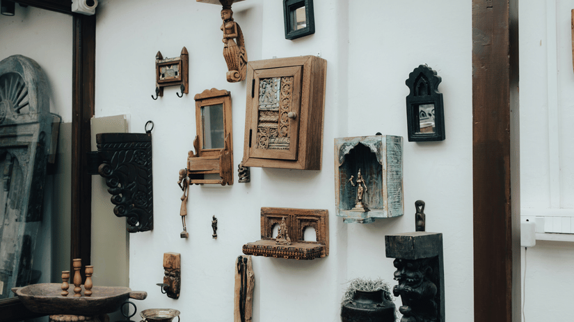Wall display of framed artefacts, tools and traditional objects inside a museum like that at the Government Museum, Pudukkottai