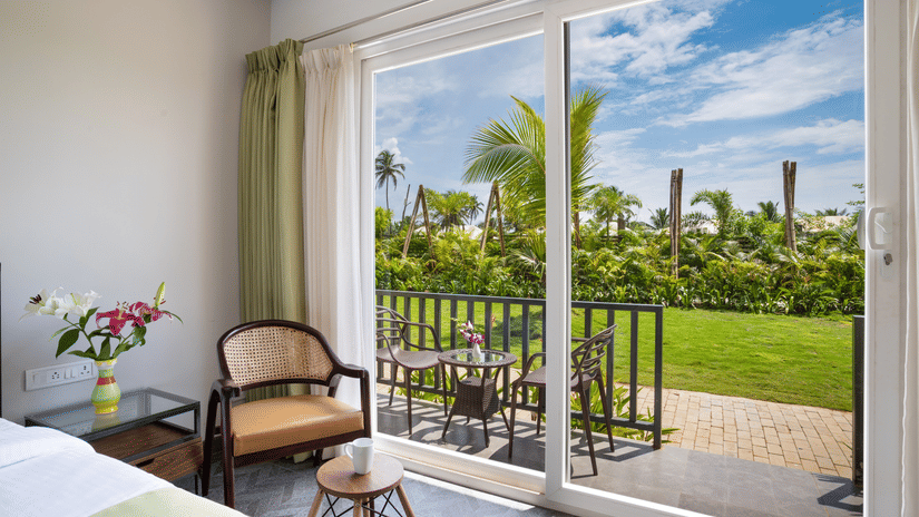 image of the beautiful scenic view from the huge french windows of the premium cottage at sibaya beach resort, morjim beach