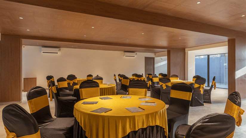 Event hall venue arranged with banquet table seating for conferences and celebrations at Sibaya Courtyard By Stone Wood Premier.