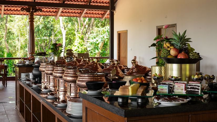 Different containers on a table for buffet at Navarasa restaurant TGI Tapovana
