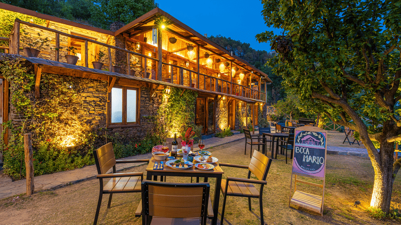 A facade image of the Boca Mario illuminated with bright lights - The Manor Luxury Hotel, Shimla