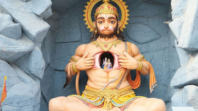 A Hanuman Statue in a sitting position with Rama and Sita depicted in the chest opening