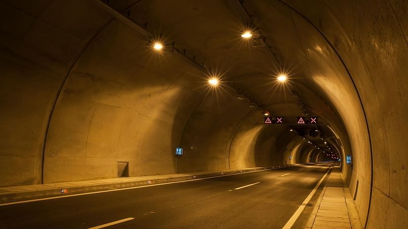 A tunnel with yellow lights 