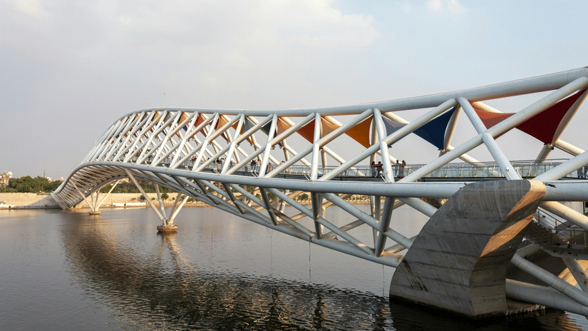 Side wide view of Atal pedestrian bridge with its modern and colourful architecture on Ganges river.