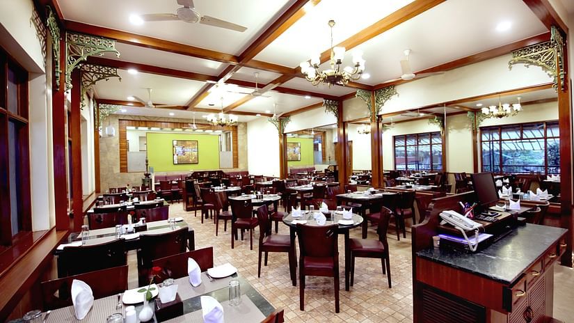the indoor seating space at the restaurant - Zara's Resort 1
