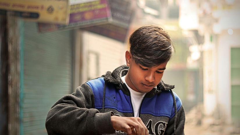 a boy eating litti chokha
