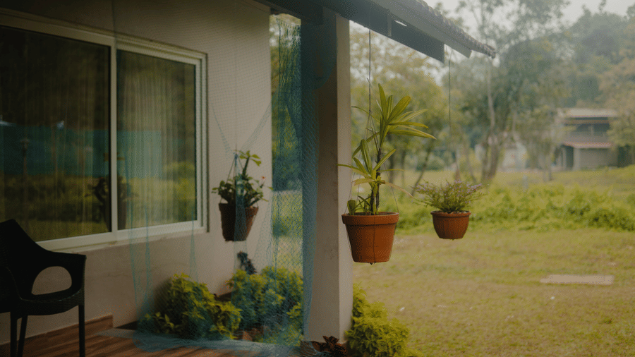 Pots hung on the outside of the room - Abad Brookside Lakkidi, Wayanad