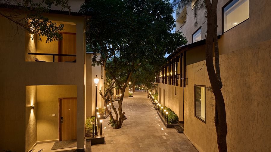 exterior facade of two buildings at ABN Sarovar Portico, Jim Corbett at dusk